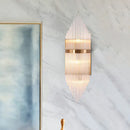 Modern gold geometric wall sconce with clear glass for living room