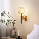 Modern gold iron led sconce lamp with textured glass for bedroom