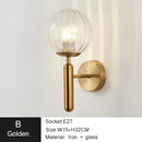 Modern gold iron led sconce lamp with textured glass for bedroom