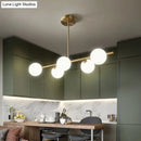 DecorBites™ Sleek and Elegant Linear Gold Island Pendant Lighting with Spherical Glass Shades for Dining Table