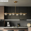 DecorBites™ Sleek and Elegant Linear Gold Island Pendant Lighting with Spherical Glass Shades for Dining Table