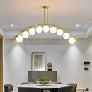 Modern gold island pendant with clear white shade for kitchens