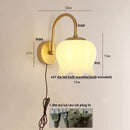 Modern gold led wall sconce with frosted glass for stairway lighting