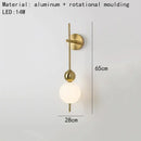 Modern gold led wall sconce with frosted glass spheres for bedroom