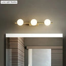 Modern gold linear wall sconce with milky ball glass for bathroom