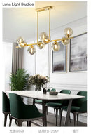 Modern gold metal amber glass island light for dining room