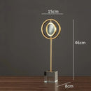 Modern gold metal eye magnifying glass with glass base living room decor