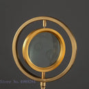 Modern gold metal eye magnifying glass with glass base living room decor