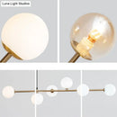 Modern gold metal island pendant with blue glass spheres dining room