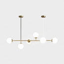 Modern gold metal island pendant with blue glass spheres dining room