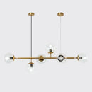 Modern gold metal island pendant with blue glass spheres dining room
