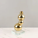 Modern gold metal spheres stacked art pieces living room decor