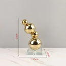 Modern gold metal spheres stacked art pieces living room decor