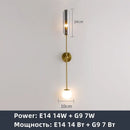 Modern gold metal wall light bedroom sconce with frosted globe
