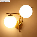 Modern gold milk glass orb sconce light bedroom wall fixture