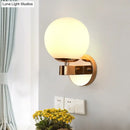 Modern gold opal glass ball wall light – living room sconce