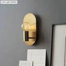 Modern gold oval sconce bedroom light with bare bulb metal shade