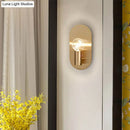 Modern gold oval sconce bedroom light with bare bulb metal shade