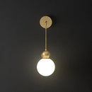 Modern gold sconce light with milky glass – bedroom wall lamp