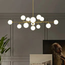 Modern gold sputnik chandelier with white glass shades living room
