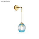 Modern gold tulip wall lamp with blue glass shade for bedroom