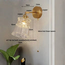 Modern gold wall lamp with clear glass shade – bedroom pull chain