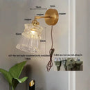 Modern gold wall lamp with clear glass shade – bedroom pull chain