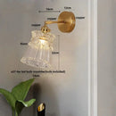 Modern gold wall lamp with clear glass shade – bedroom pull chain