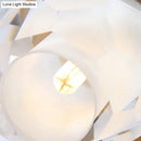 Modern gold wall lamp with faceted globe shade for hallway