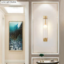 Modern gold wall light fixture with frosted glass for living room