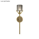 Modern gold wall light with clear crystal block cylinder bedroom