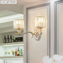 Modern gold wall light with clear crystal shade – living room sconce