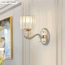Modern gold wall light with clear crystal shade – living room sconce