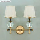 Modern gold wall light with crystal and fabric shade bedroom