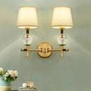 Modern gold wall light with crystal and fabric shade bedroom
