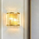 Modern gold wall sconce with clear crystal rods for hallways