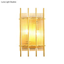Modern gold wall sconce with clear crystal rods for hallways