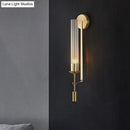 Modern gold wall sconce with clear glass shade bathroom light