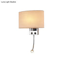 Modern gold wall sconce with fabric shade and bedroom reading light