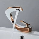 Modern gold & white bathroom basin faucet with curved spout