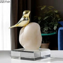 Modern golden bird statue with stone base living room ornament