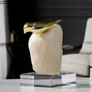 Modern golden bird statue with stone base living room ornament