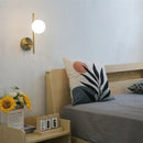 Modern golden led wall lights with milky glass spheres bedroom sconce
