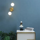 Modern golden led wall lights with milky glass spheres bedroom sconce