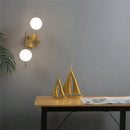Modern golden led wall lights with milky glass spheres bedroom sconce