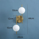 Modern golden led wall lights with milky glass spheres bedroom sconce