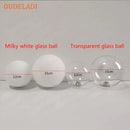 Modern golden led wall sconce with milky glass globes for bedroom