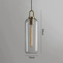 Modern gray glass ball pendant lights – dining room brass accents