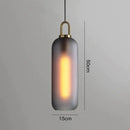 Modern gray glass ball pendant lights – dining room brass accents
