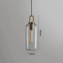 Modern gray glass ball pendant lights – dining room brass accents
